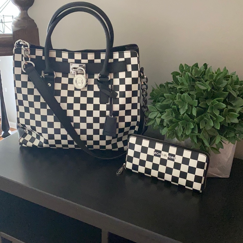 Michael Kors black and white purse and wallet.